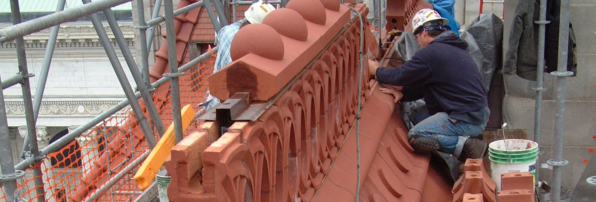 Worker installing terra cotta